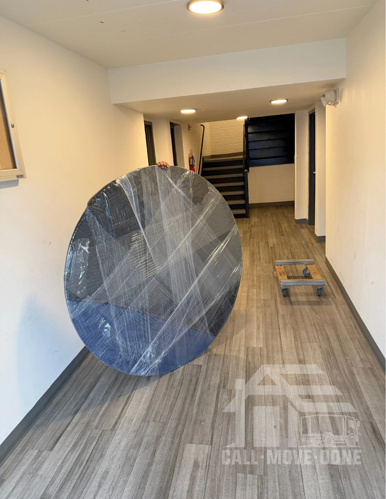 A six-foot round table doesn't fit through anything — until it does