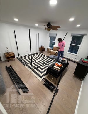 Mover reassembling a bed frame in the new home