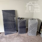 Wrapped and padded furniture staged for loading